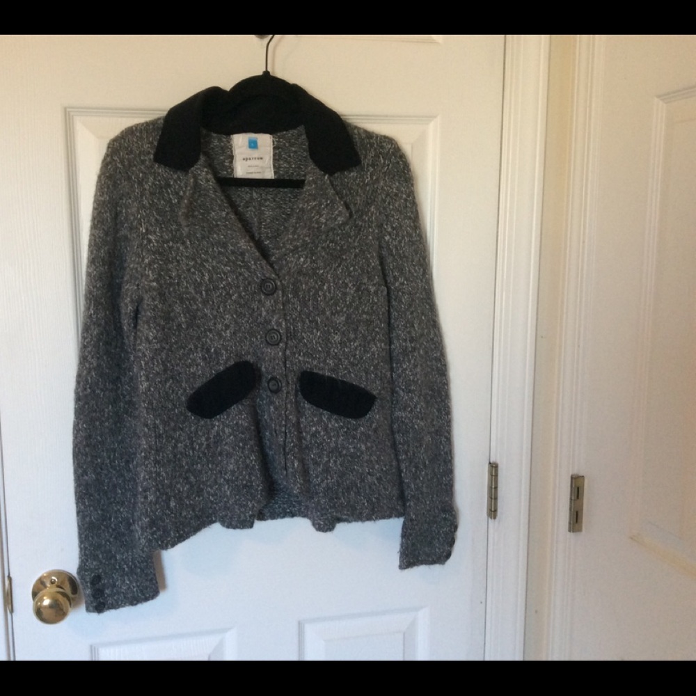 A grey cardigan with a black collar